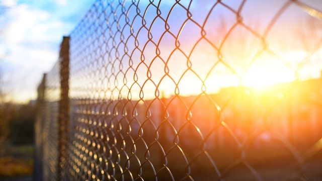 Chain link fencing at sunset providing durable perimeter security and visibility for commercial properties in Stockton, CA