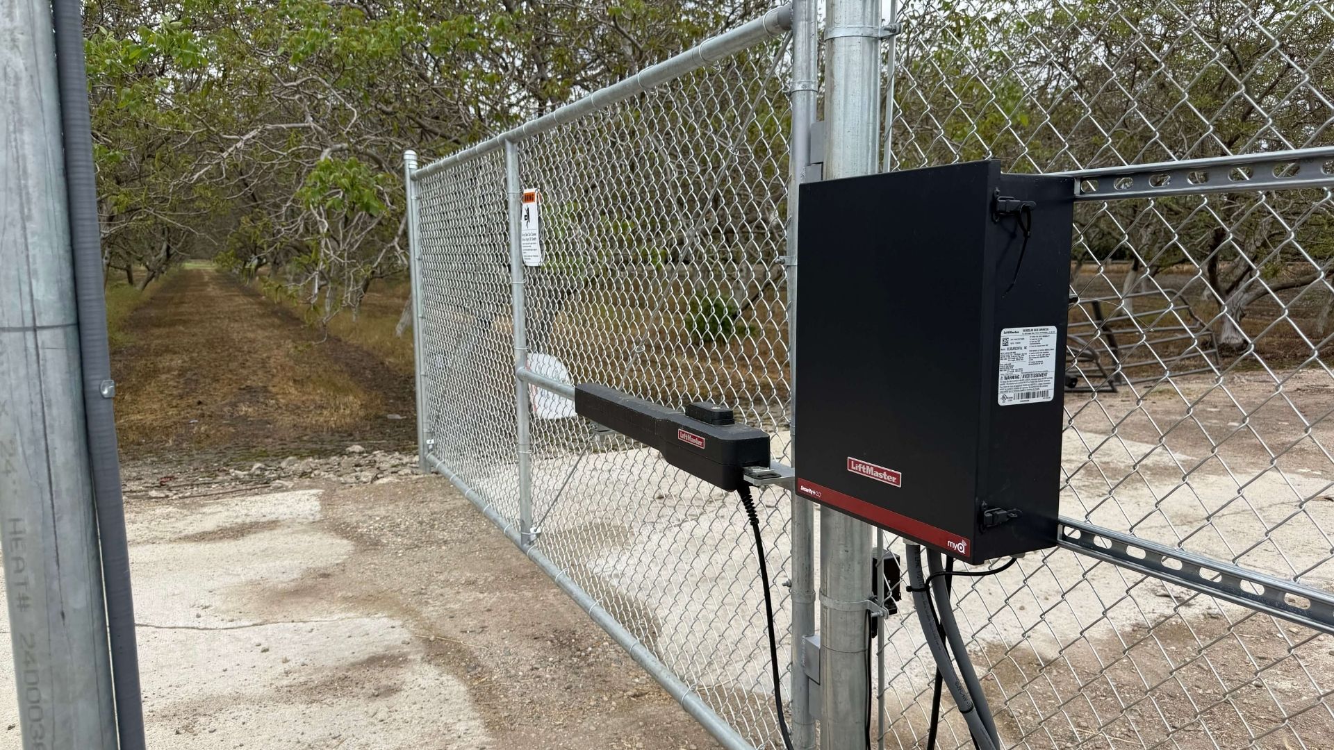 Automatic solar gate system and chain link perimeter fencing in Merced County California
