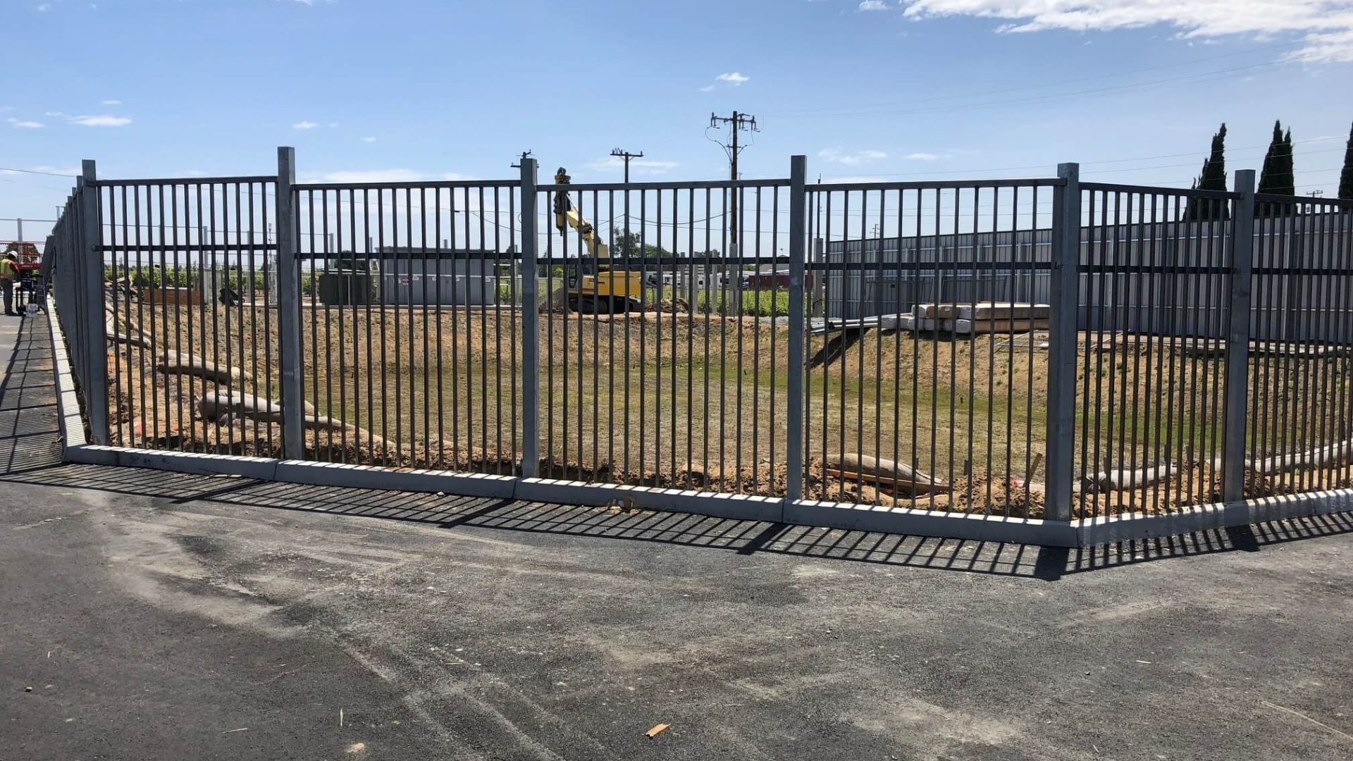 Industrial ornamental iron fence and 12 foot automatic gate project in Antioch California