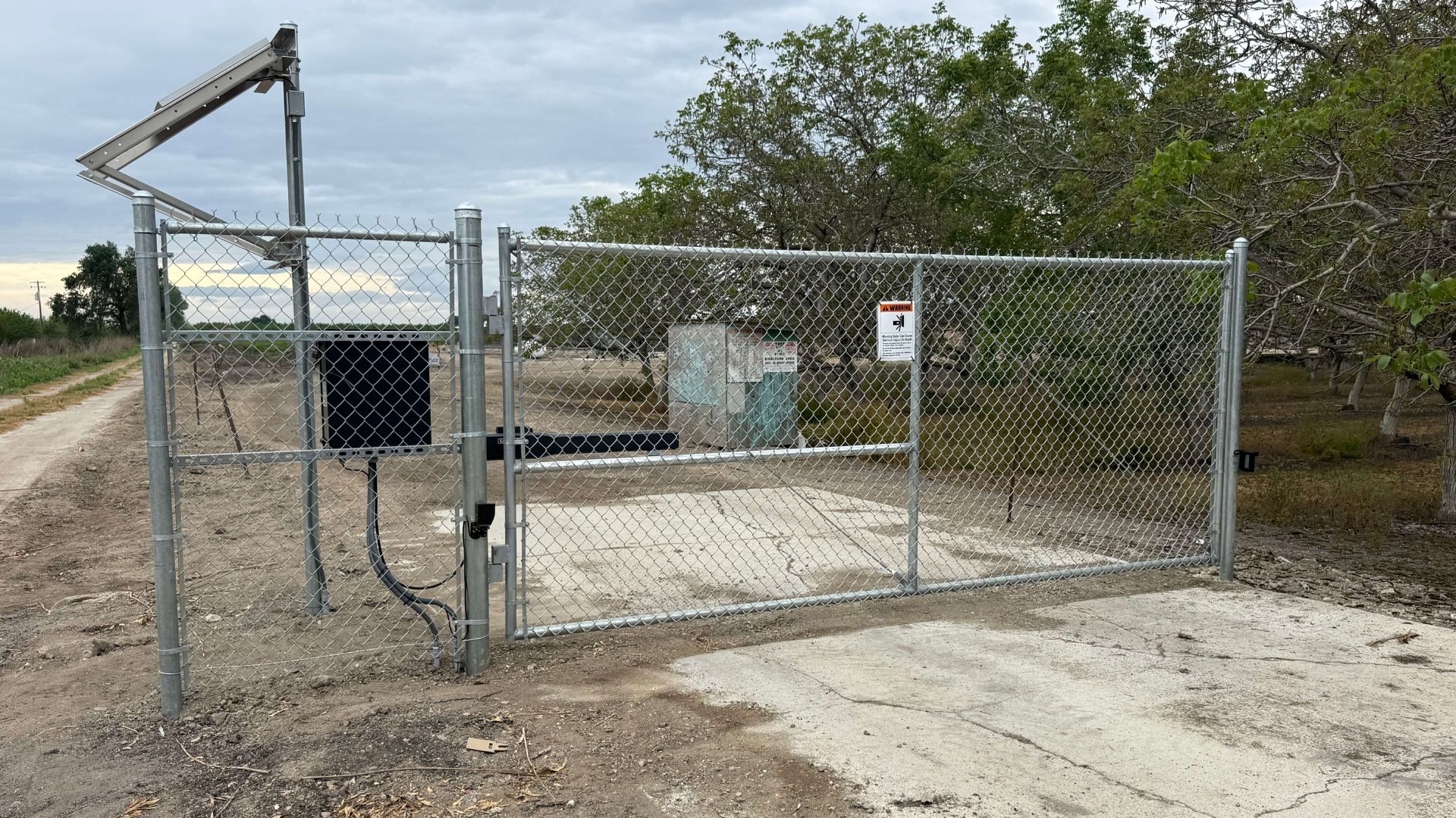 Automatic solar gate system and chain link perimeter fencing in Merced County California